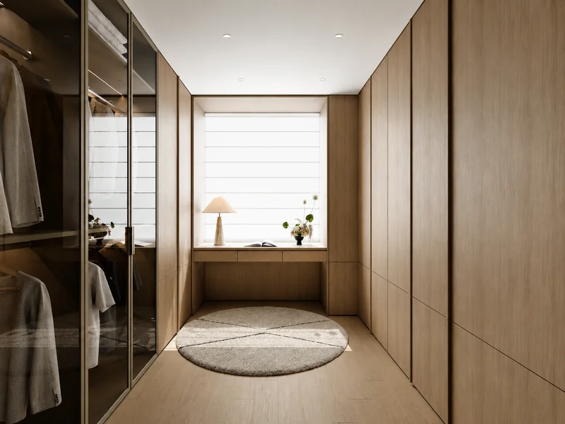 Custom walk-in closet with natural wood wardrobes, glass-front storage and built-in cabinetry