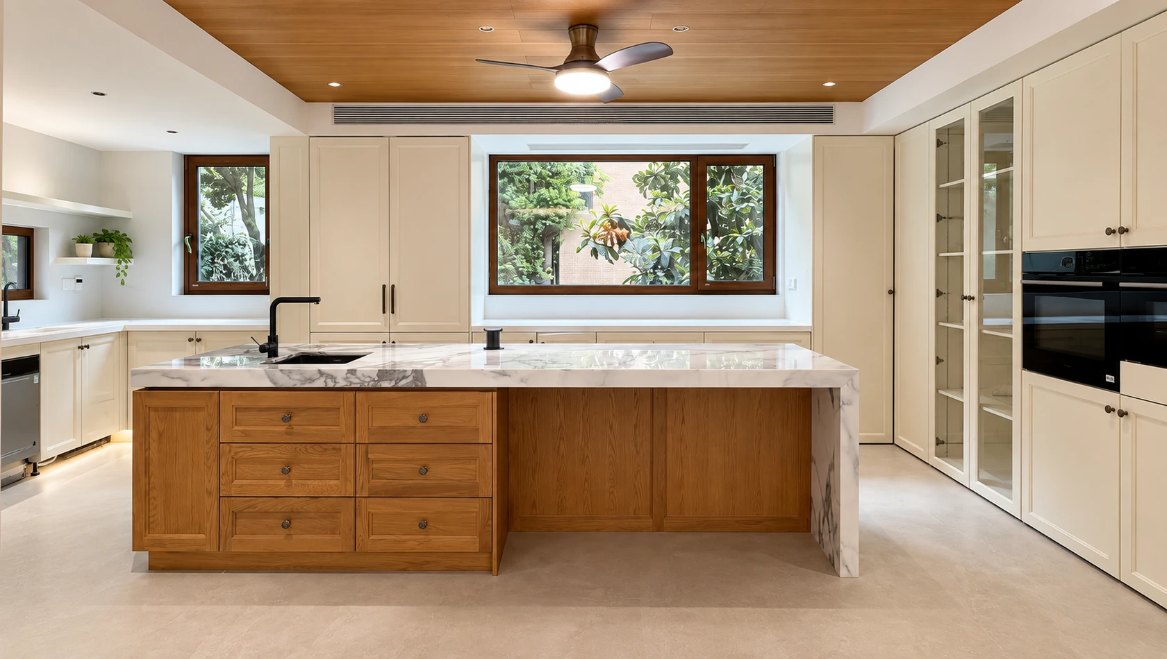 Two-tone custom kitchen cabinetry with a warm wood island, white framed cabinets and stone countertops.